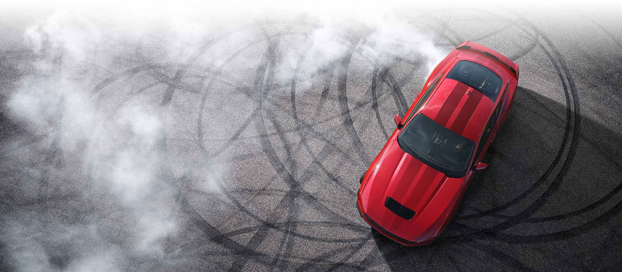 Overhead view of a 2024 Ford Mustang® model with tire tracks on pavement | Donley Ford Shelby in Shelby OH